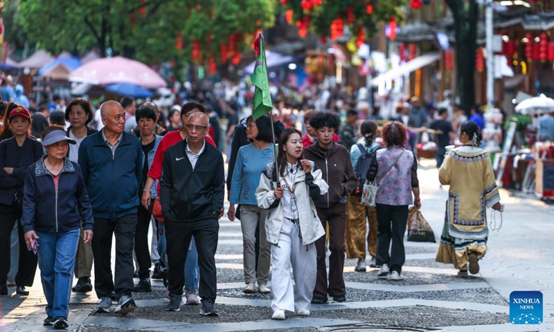 Tourists visit Zhaoxing Dong Village in Liping County, southwest China's Guizhou Province, April 20, 2026.


