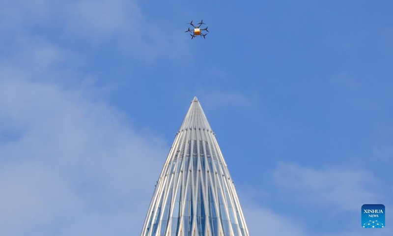 This photo taken on May 6, 2026 shows a drone delivering takeout food in Shenzhen, south China's Guangdong Province. South China's tech hub of Shenzhen now stands as a leading manufacturing base for unmanned aerial vehicles, producing 70 percent of China's consumer drones and 50 percent of its industrial drones.(Xinhua/Mao Siqian)

