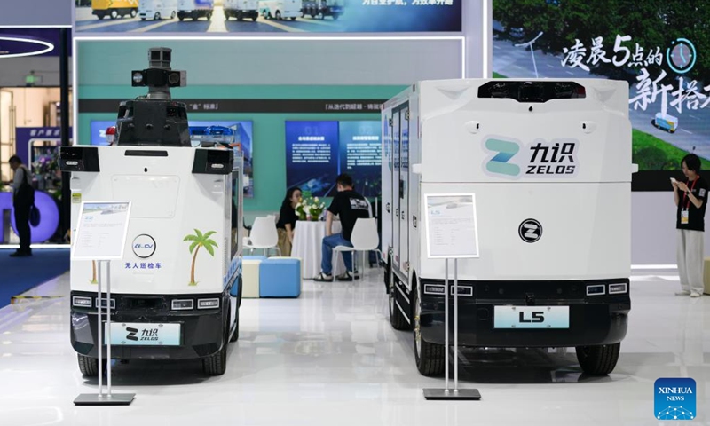 Unmanned vehicles made by Chinese unmanned logistics vehicle developer Zelos are displayed during the sixth China International Consumer Products Expo (CICPE) in Haikou, south China's Hainan Province, April 14, 2026. The ongoing sixth CICPE features groundbreaking innovations in artificial intelligence (AI). A wide range of new tech consumer products are showcased at the event, spanning multiple sectors including smart interaction, wearable devices, and smart healthcare. (Xinhua/Xin Yuewei)