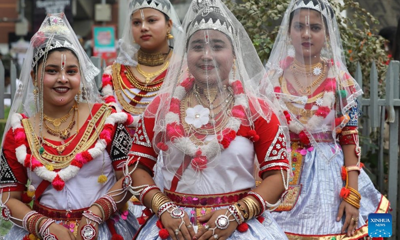 Women attend a procession in celebration of the Bengali New Year, known as Pohela Boishakh, in Dhaka, Bangladesh, April 14, 2026. Bangladesh celebrated Bengali New Year 1433 on Tuesday with processions, traditional food and cultural events in the capital Dhaka and elsewhere in the South Asian country. (Photo by Habibur Rahman/Xinhua)

