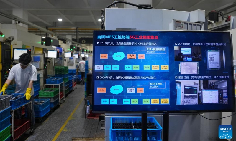 A technician debugs a humanoid robot at a company in Ningbo, east China's Zhejiang Province, March 26, 2026. (Xinhua/Huang Zongzhi)

