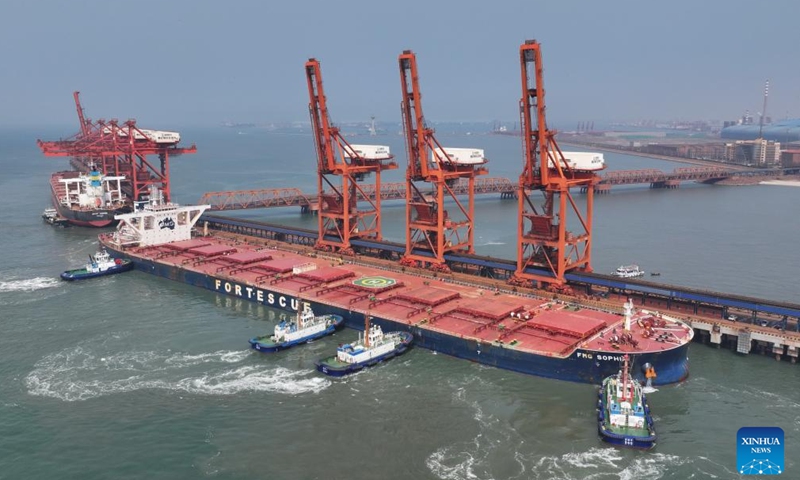 A drone photo taken on April 15, 2026 shows a vessel docking at the ore terminal of Caofeidian Port Area in Tangshan Port in Tangshan, north China's Hebei Province. From January to March this year, Caofeidian Port Area handled a cargo throughput of 138.03 million tonnes, marking a year-on-year increase of 3.16 percent. (Xinhua/Yang Shiyao)

