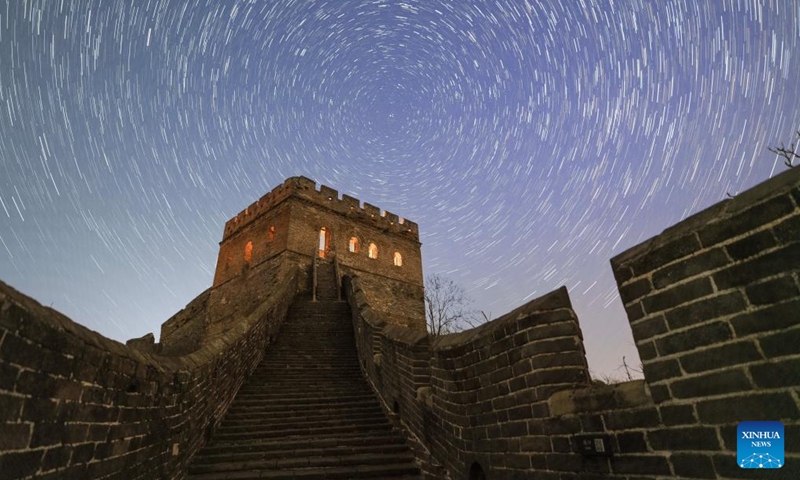 This stack composite photo taken on April 15, 2026 shows a view of the starry sky above the Jinshanling section of the Great Wall in Chengde City, north China's Hebei Province. (Photo by Zhong Yi/Xinhua)