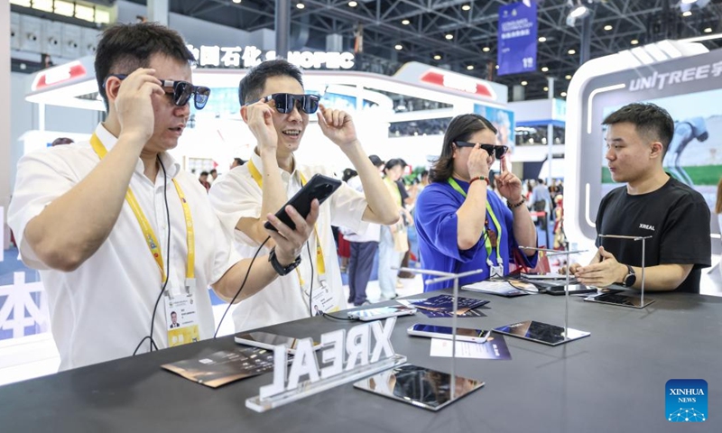 Visitors wear smart glasses during the sixth China International Consumer Products Expo (CICPE) in Haikou, south China's Hainan Province, April 13, 2026. The ongoing sixth CICPE features groundbreaking innovations in artificial intelligence (AI). A wide range of new tech consumer products are showcased at the event, spanning multiple sectors including smart interaction, wearable devices, and smart healthcare. (Xinhua/Zhang Liyun)