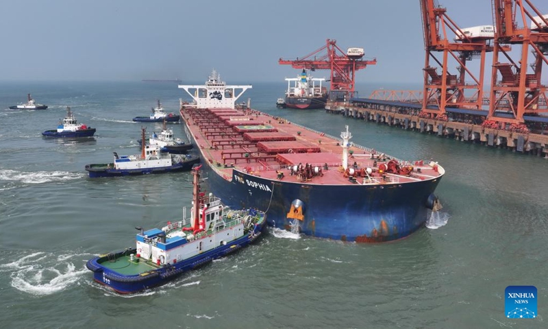 A drone photo taken on April 15, 2026 shows a vessel docking at the ore terminal of Caofeidian Port Area in Tangshan Port in Tangshan, north China's Hebei Province. From January to March this year, Caofeidian Port Area handled a cargo throughput of 138.03 million tonnes, marking a year-on-year increase of 3.16 percent. (Xinhua/Yang Shiyao)

