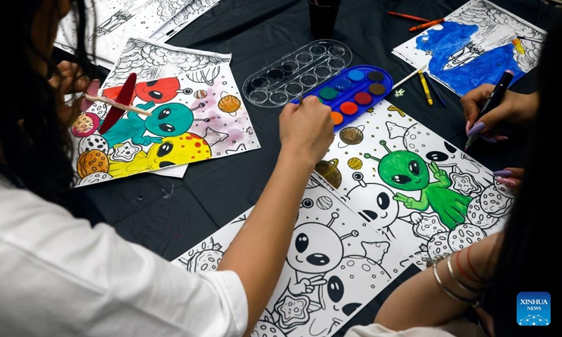 Children draw pictures during the opening day of Spacefest 2026 at the Politehnica University in Bucharest, Romania, May 7, 2026. The Spacefest is an event dedicated to science, innovation and space exploration, with discussions and presentations about the future of space flight, emerging technologies and collaboration opportunities in the aerospace industry. (Photo by Cristian Cristel/Xinhua)

