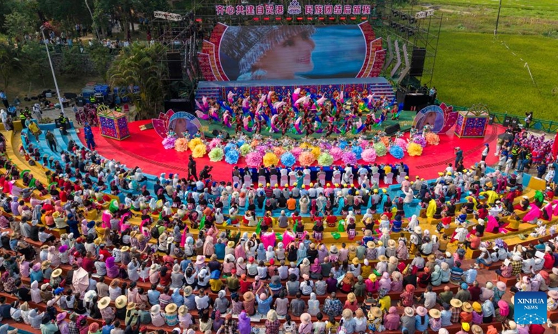 An aerial drone photo taken on April 19, 2026 shows an event celebrating the Sanyuesan Festival in Qionghai, south China's Hainan Province. The Sanyuesan Festival is a traditional festival celebrated on the third day of the third lunar month by various ethnic groups in China, which falls on April 19 this year. (Photo by Meng Zhongde/Xinhua)

