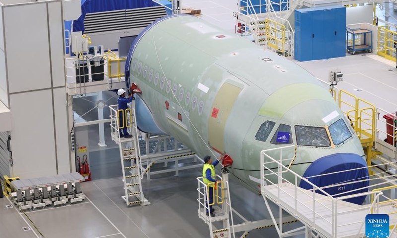 Staff members work at Airbus' second A320 family final assembly line in Tianjin, north China, Nov. 17, 2025. (Airbus/Handout via Xinhua)

