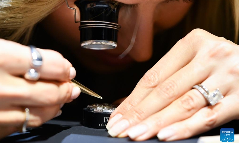 A visitor tries watchmaking during the Watches and Wonders Geneva 2026 at the Palexpo in Geneva, Switzerland, April 14, 2026. The 7-day event kicked off here on Tuesday, bringing together 65 participating brands. (Xinhua/Lian Yi)

