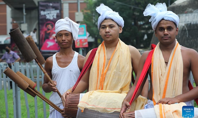 People attend a procession in celebration of the Bengali New Year, known as Pohela Boishakh, in Dhaka, Bangladesh, April 14, 2026. Bangladesh celebrated Bengali New Year 1433 on Tuesday with processions, traditional food and cultural events in the capital Dhaka and elsewhere in the South Asian country. (Photo by Habibur Rahman/Xinhua)

