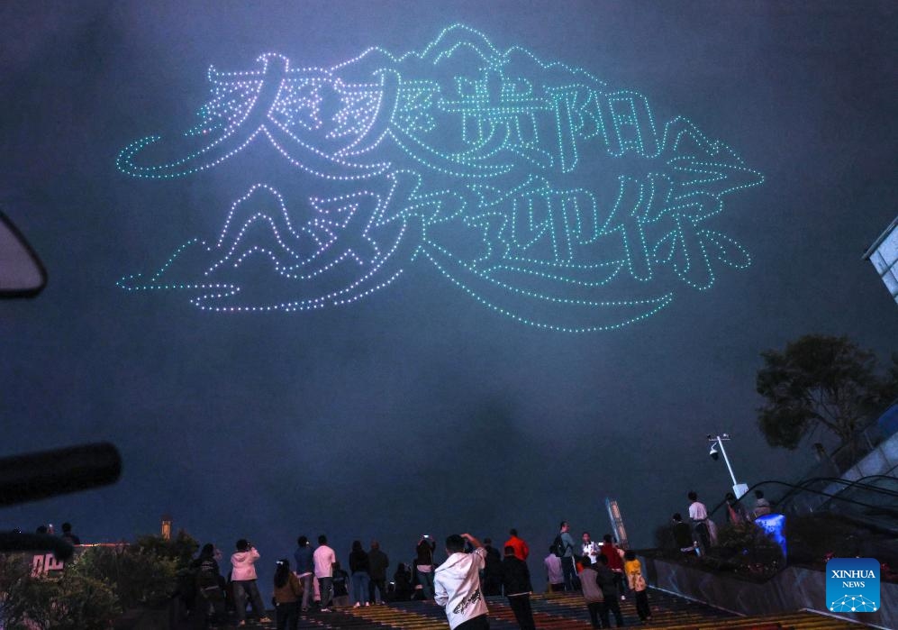 People watch a drone light show at Guanshanhu District in Guiyang, southwest China's Guizhou Province, April 14, 2026. A drone light show was staged in Guiyang on Tuesday, showcasing the city's booming big data industry and rich cultural and tourism resources. (Xinhua/Yang Wenbin)


