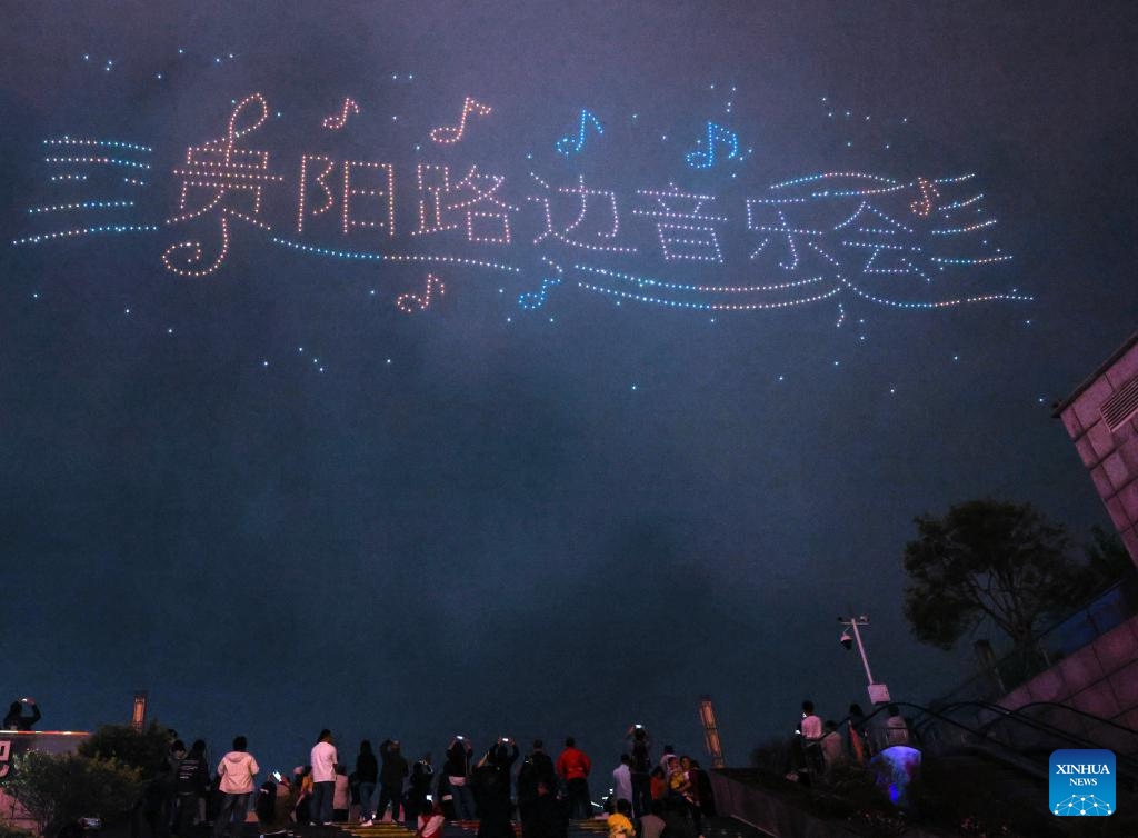 People watch a drone light show at Guanshanhu District in Guiyang, southwest China's Guizhou Province, April 14, 2026. A drone light show was staged in Guiyang on Tuesday, showcasing the city's booming big data industry and rich cultural and tourism resources. (Xinhua/Yang Wenbin)


