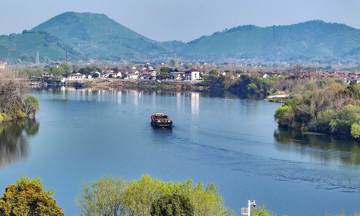A boat travels through the waterway in Xishaoxi, Anji, East China's Zhejiang Province on March 29, 2026. Photo: VCG