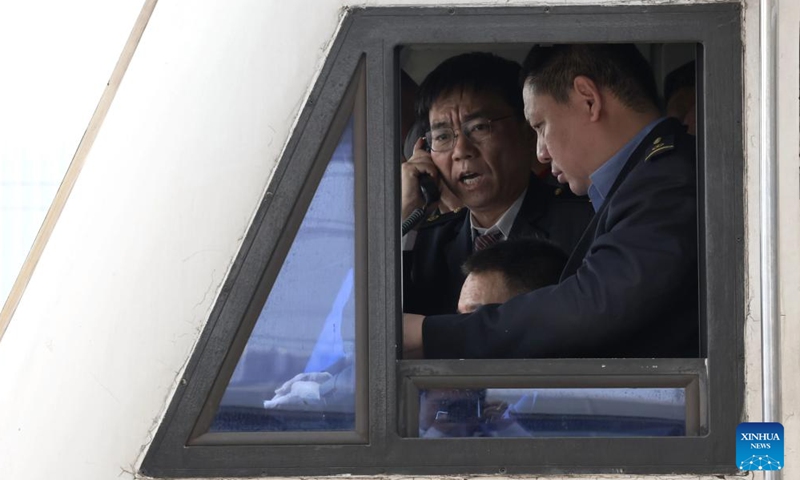 Railway staff members work on a test train which is about to depart from Xiong'an Railway Station in the Xiong'an New Area, north China's Hebei Province, April 15, 2026. (Xinhua/Xing Guangli)