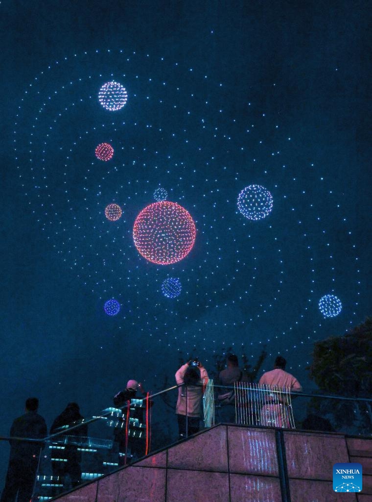 People watch a drone light show at Guanshanhu District in Guiyang, southwest China's Guizhou Province, April 14, 2026. A drone light show was staged in Guiyang on Tuesday, showcasing the city's booming big data industry and rich cultural and tourism resources. (Xinhua/Yang Wenbin)

