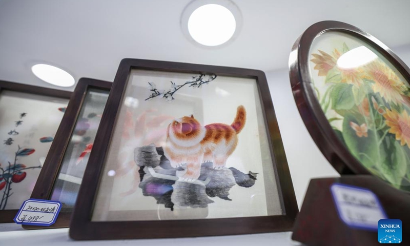 This photo taken on April 14, 2026 shows Xiang embroidery works at the sixth China International Consumer Products Expo (CICPE) in Haikou, south China's Hainan Province. From intangible cultural heritage skills to original IPs with traditional Chinese cultural characteristics, Chinese brands blend tradition with modernity and showcase their charm at the ongoing CICPE, attracting the attention of many visitors. (Xinhua/Zhang Liyun)