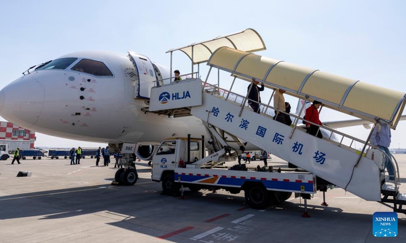 Passengers disembark a C919 jetliner operated by China Eastern Airlines at Harbin Taiping International Airport in Harbin, northeast China's Heilongjiang Province, April 15, 2026. The flight MU5631 carrying 140 passengers landed in Harbin on Wednesday, marking a successful maiden flight of C919, China's homegrown large passenger aircraft, on the Harbin-Shanghai route of China Eastern Airlines. (Xinhua/Zhang Tao)

