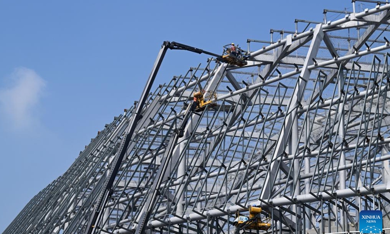 Workers work at the construction site of the Burning Plasma Experimental Superconducting Tokamak (BEST) in Hefei, east China's Anhui Province, April 15, 2026. Dubbed the artificial sun, the BEST facility represents one of China's major ventures into controlled nuclear fusion and is poised to attempt the world's first fusion energy power generation demonstration. (Xinhua/Fu Tian)

