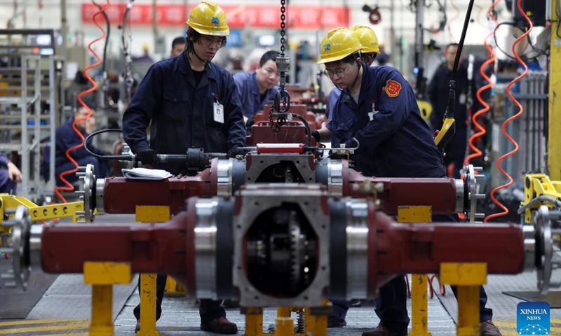 Employees work at an assembly line of China Yituo Group Co., Ltd. in Luoyang, central China's Henan Province, April 14, 2026.

