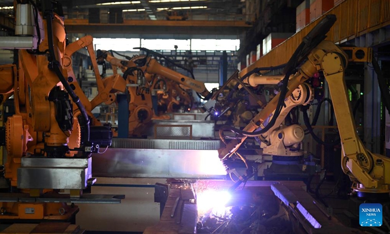 Automatic cutting robots work on a production line at a factory of ZCZL Industrial Technology Group in Zhengzhou, central China's Henan Province, March 30, 2026.

