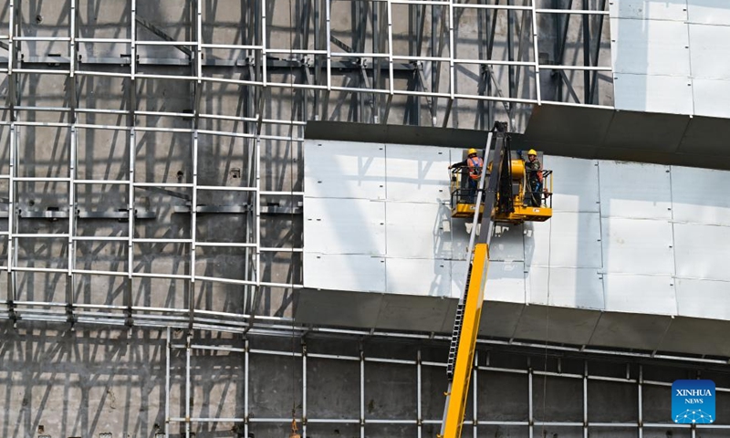 Workers work at the construction site of the Burning Plasma Experimental Superconducting Tokamak (BEST) in Hefei, east China's Anhui Province, April 15, 2026. Dubbed the artificial sun, the BEST facility represents one of China's major ventures into controlled nuclear fusion and is poised to attempt the world's first fusion energy power generation demonstration. (Xinhua/Ma Jinrui)


