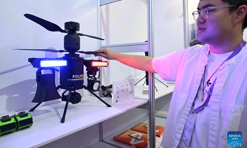 An exhibitor introduces a police drone at the 139th edition of the China Import and Export Fair in Guangzhou, south China's Guangdong Province, April 15, 2026. The 139th edition of the China Import and Export Fair, also known as the Canton Fair, opened here on Wednesday, drawing a record number of over 32,000 participating enterprises. (Xinhua/Deng Hua)

