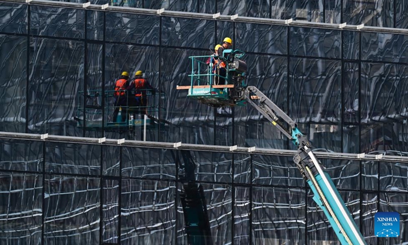 Workers work at the construction site of the Burning Plasma Experimental Superconducting Tokamak (BEST) in Hefei, east China's Anhui Province, April 15, 2026. Dubbed the artificial sun, the BEST facility represents one of China's major ventures into controlled nuclear fusion and is poised to attempt the world's first fusion energy power generation demonstration. (Xinhua/Zhou Mu)


