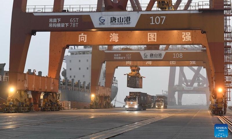 Vehicles transport containers at a container terminal of the Jingtang area of Tangshan Port in Tangshan, north China's Hebei Province, April 18, 2026.

According to the authorities, the cargo throughput of Tangshan Port reached 215.48 million tonnes in the first quarter of 2026, up 3.67 percent year-on-year. Photo: Xinhua