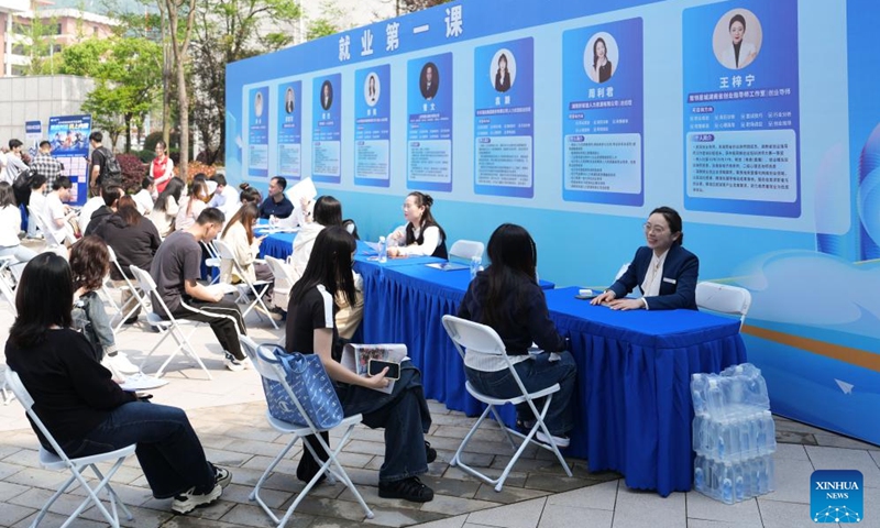 Job seekers receive consulting service at a job fair held at Hunan Normal University in Changsha, central China's Hunan Province, April 18, 2026. The two-day job fair for university graduates kicked off on Saturday, with the main venues in Hunan University and Hunan Normal University. (Xinhua/Chen Zhenhai)