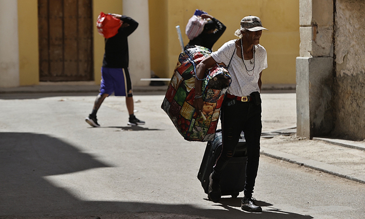 People walk down a street in Havana, Cuba, on April 10, 2026. Photo: VCG