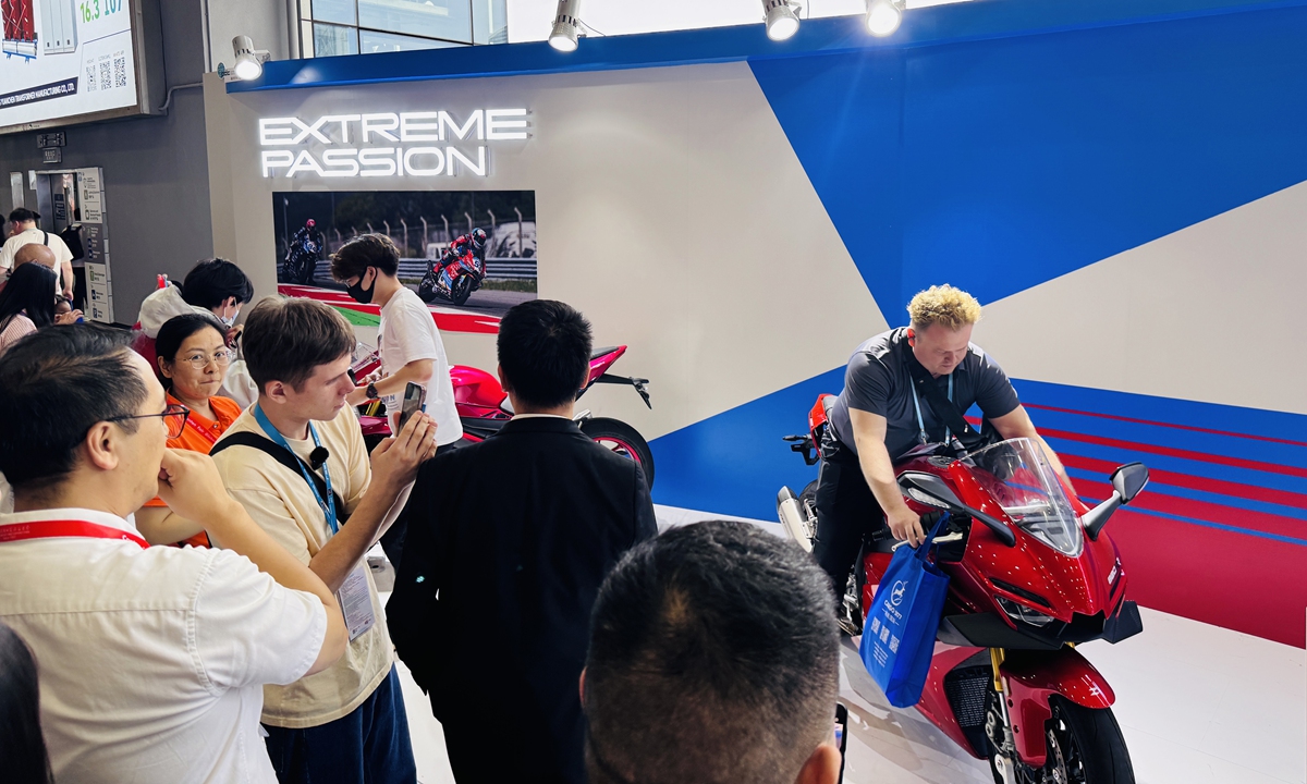 A foreign visitor tests a Chinese motorcycle at the 139th Canton Fair on April 19, 2026. The fair has attracted about 250 domestic companies and brands in the motorcycle industry and their supply chains. Photo: Chi Jingyi/GT