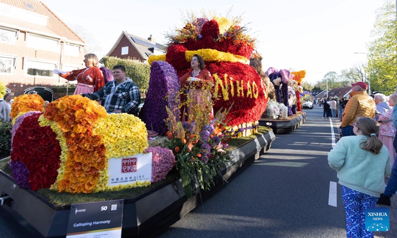 People watch floats during the Flower Parade of the Bollenstreek in Bennebroek, the Netherlands, April 18, 2026. (Photo by Sylvia Lederer/Xinhua)