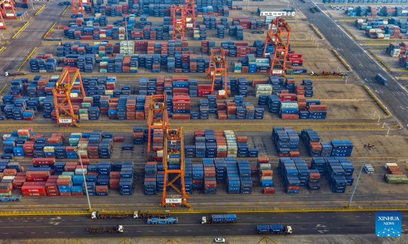 An aerial photo taken on April 17, 2026 shows vehicles transporting containers at a container terminal of the Jingtang area of Tangshan Port in Tangshan, north China's Hebei Province.

According to the authorities, the cargo throughput of Tangshan Port reached 215.48 million tonnes in the first quarter of 2026, up 3.67 percent year-on-year. Photo: Xinhua