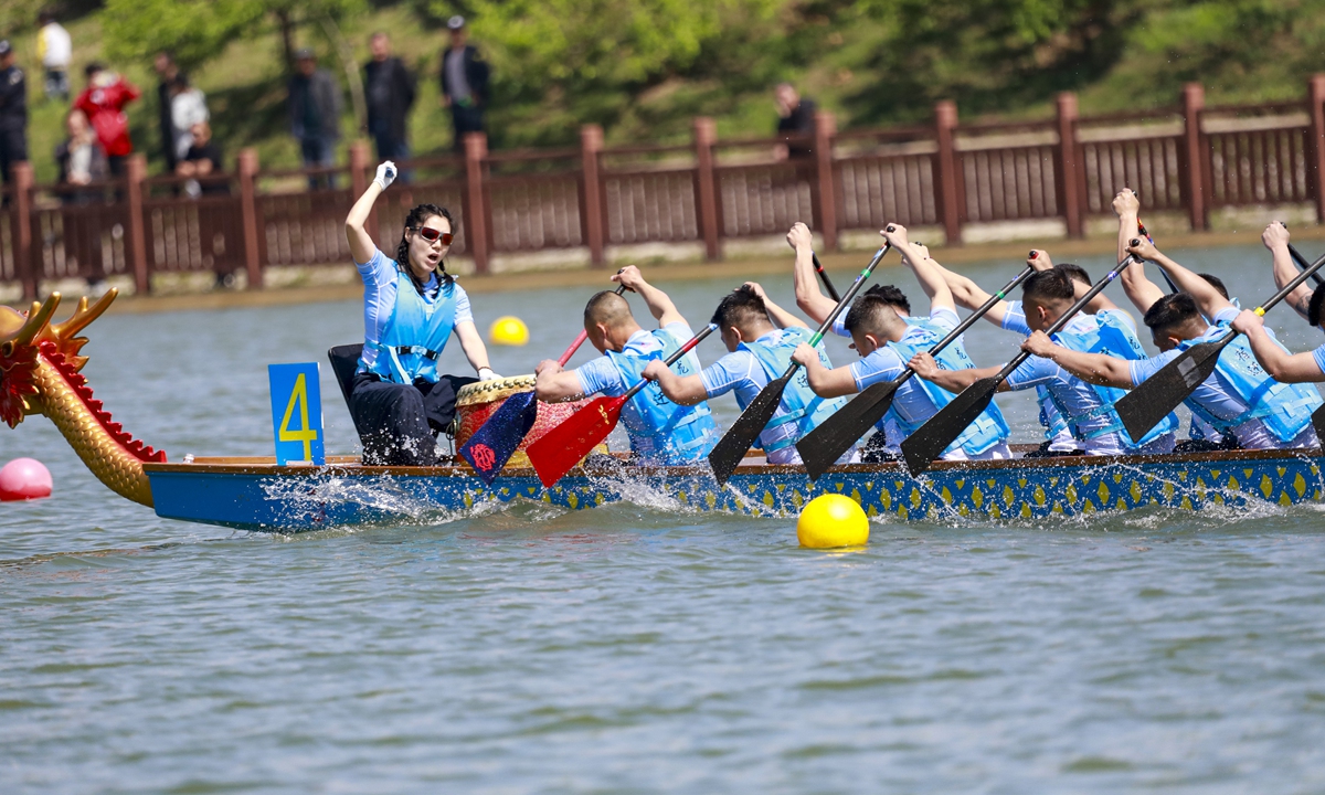 A dragon boat race takes place on a river in Sihong county, East China's Jiangsu Province, on April 19, 2026. The local dragon boat competition kicked off on the same day, featuring 12 dragon boat teams from across Jiangsu competing in 200- and 500- meter straight-line races. Photo: VCG