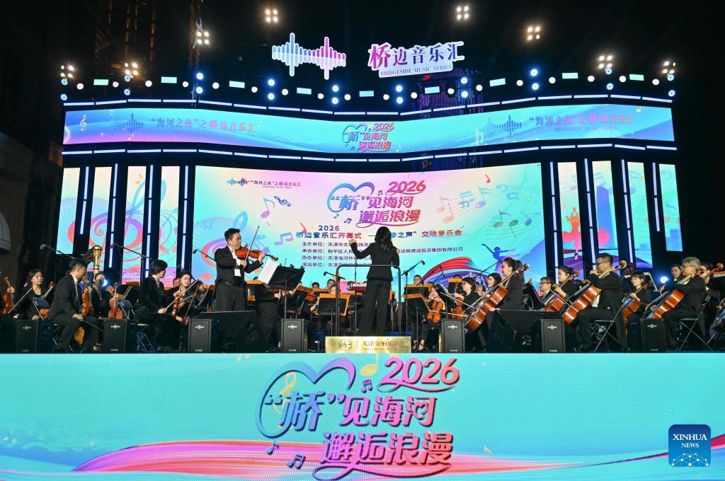 Tianjin Symphony Orchestra performs at the Jinwan Square by the Haihe River in north China's Tianjin, April 18, 2026. 