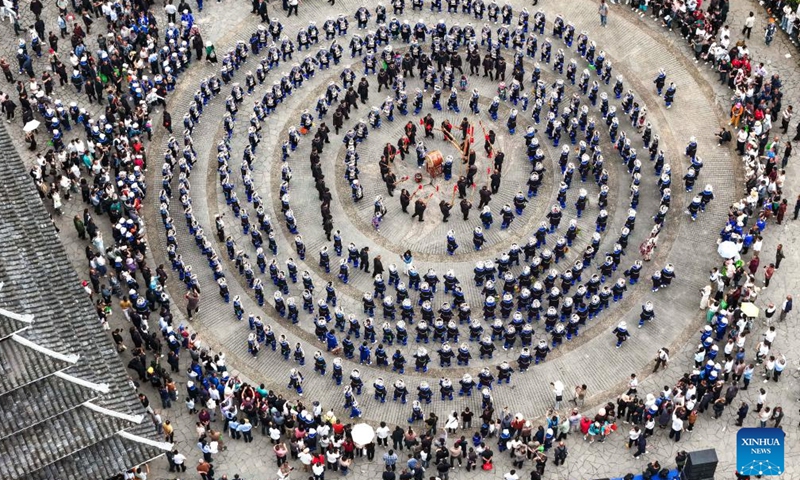 An aerial drone photo taken on April 19, 2026 shows people of the Dong ethnic group participating in an event celebrating the Sanyuesan Festival at Zhenyuan County in southwest China's Guizhou Province. The Sanyuesan Festival is a traditional festival celebrated on the third day of the third lunar month by various ethnic groups in China. The festival falls on April 19 this year. (Xinhua/Yang Wenbin)

