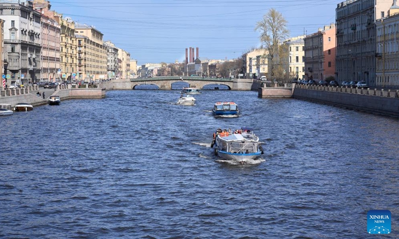 Sightseeing boats travel on the Fontanka River in St. Petersburg, Russia, April 19, 2026. St. Petersburg features a dense network of waterways and over 300 bridges crisscrossing the city. (Photo by Guo Feizhou/Xinhua)

