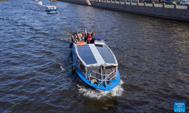 A sightseeing boat travels on the Fontanka River in St. Petersburg, Russia, April 19, 2026. St. Petersburg features a dense network of waterways and over 300 bridges crisscrossing the city. (Photo by Guo Feizhou/Xinhua)

