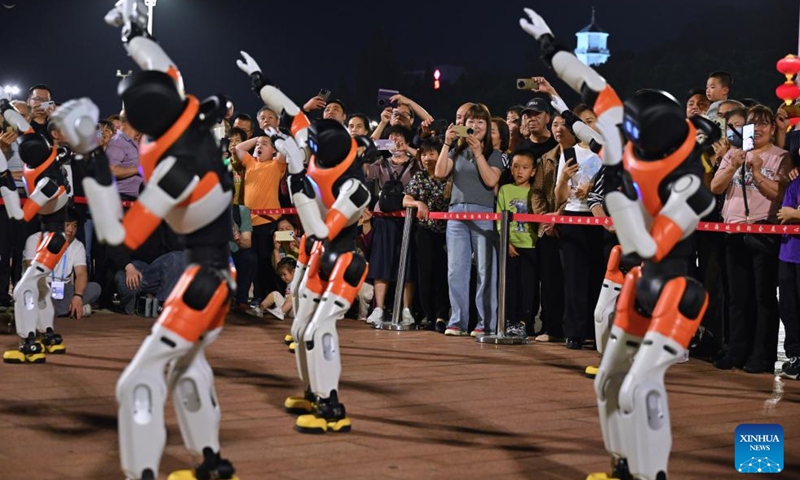 Robots dance in Fuzhou, southeast China's Fujian Province, April 19, 2026. A robot dance performance was staged here to welcome the 9th Digital China Summit, which will convene in Fuzhou from April 29 to 30. (Xinhua/Jiang Kehong)

