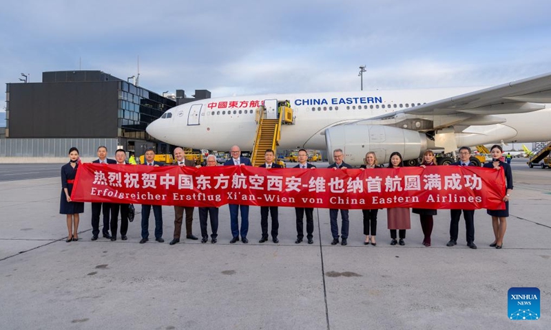 Guests and the crew members of China Eastern Airlines flight MU5063 from Xi'an of China pose for a group photo at the Vienna Airport in Vienna, Austria, April 20, 2026. (Vienna Airport/Handout via Xinhua)

