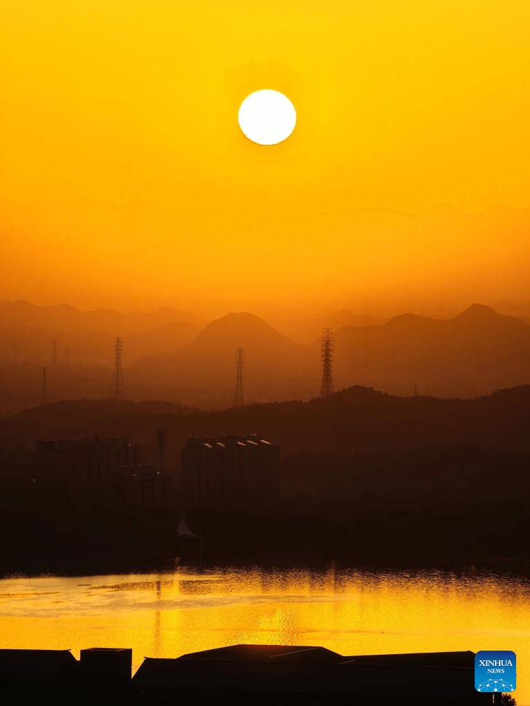 This photo taken on April 21, 2026 shows a view of the morning glow over Beijing, capital of China. (Photo by Wen Hongzheng/Xinhua)

