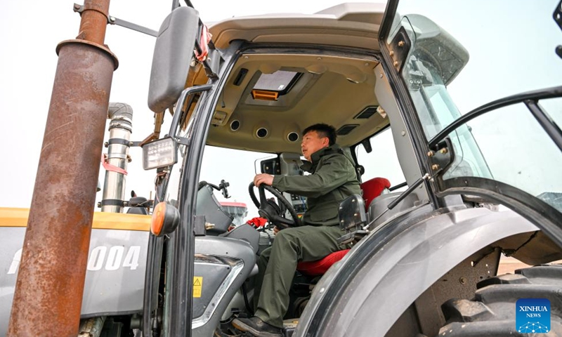 A farmer drives agricultural machinery to plough the fields in Horqin Left Wing Rear Banner of Tongliao City, north China's Inner Mongolia Autonomous Region, April 19, 2026. The ploughing work in Tongliao, a granary of eastern Inner Mongolia, is drawing to a close ahead of the peak period of corn sowing. It is learned that Tongliao's corn planting area in 2026 is expected to reach 20 million mu (1.33 million hectares). (Xinhua/Lian Zhen)

