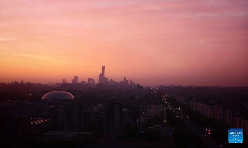 This photo taken on April 21, 2026 shows a view of the morning glow over Beijing, capital of China. (Xinhua/Xing Guangli)


