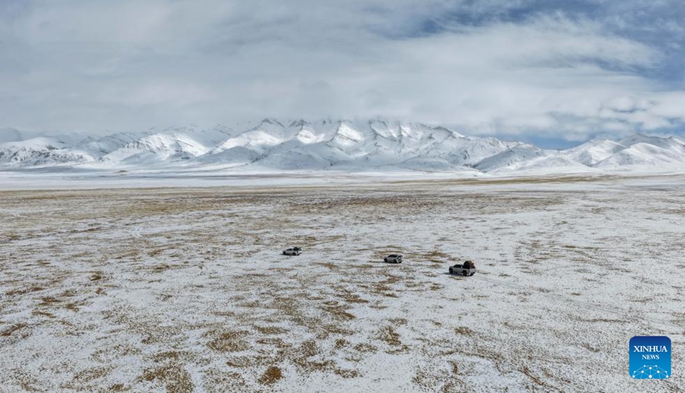 A drone photo taken on April 9, 2026 shows wildlife conservation officers from Nagqu patrolling at the Changtang National Nature Reserve in southwest China's Xizang Autonomous Region. (Photo by Liang Chunning/Xinhua)

