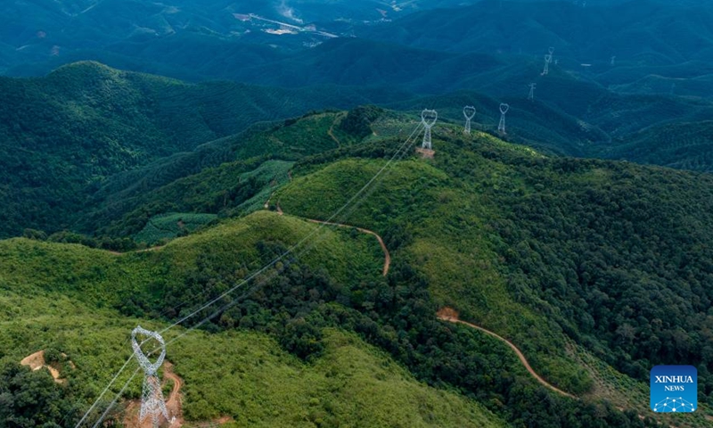 This file photo taken on Nov. 11, 2025 shows a section of power transmission line of the China-Laos 500-kV interconnection project in Mengla County, Xishuangbanna Dai Autonomous Prefecture, southwest China's Yunnan Province. China's first 500-kV cross-border alternating-current power interconnection project went into operation on Monday, sharply expanding electricity exchange capacity between China and Laos, China Southern Power Grid Co., Ltd. said. (China Southern Power Grid/Handout via Xinhua)

