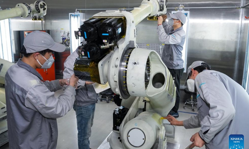 Staff members work on the production line at a workshop of Inovance in Jiangning economic development zone of Nanjing, east China's Jiangsu Province, on March 17, 2026.