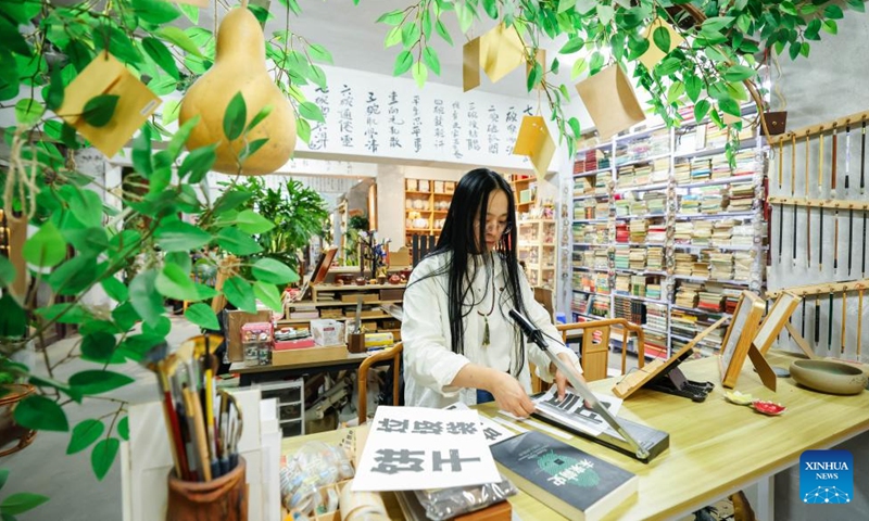 Ma Ruofan works at Fanmo Bookstore in Changchun, northeast China's Jilin Province, April 18, 2026.