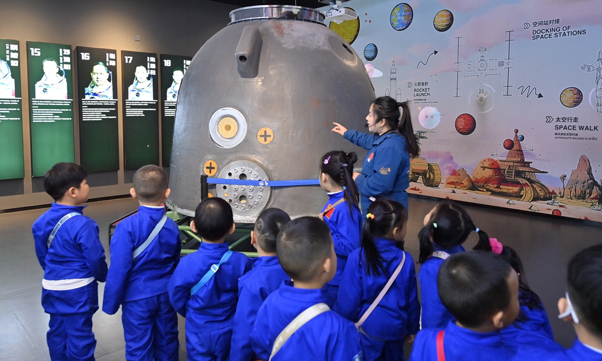As China Space Day approaches, children visit a model of the Shenzhou spacecraft return capsule in Changchun, Northeast China's Jilin Province, on April 22, 2026. First established in 2016, China Space Day is held every year on April 24.