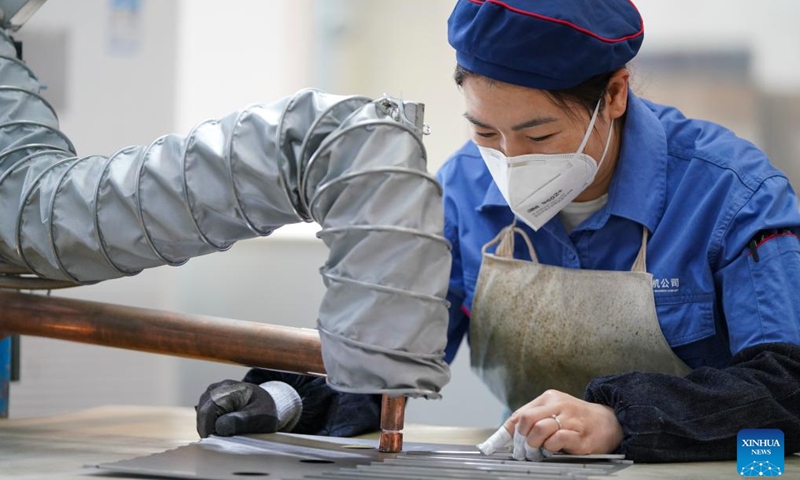 An employee works inside a workshop of Harbin Electric Machinery Company Limited in Harbin, northeast China's Heilongjiang Province, on April 21, 2026.