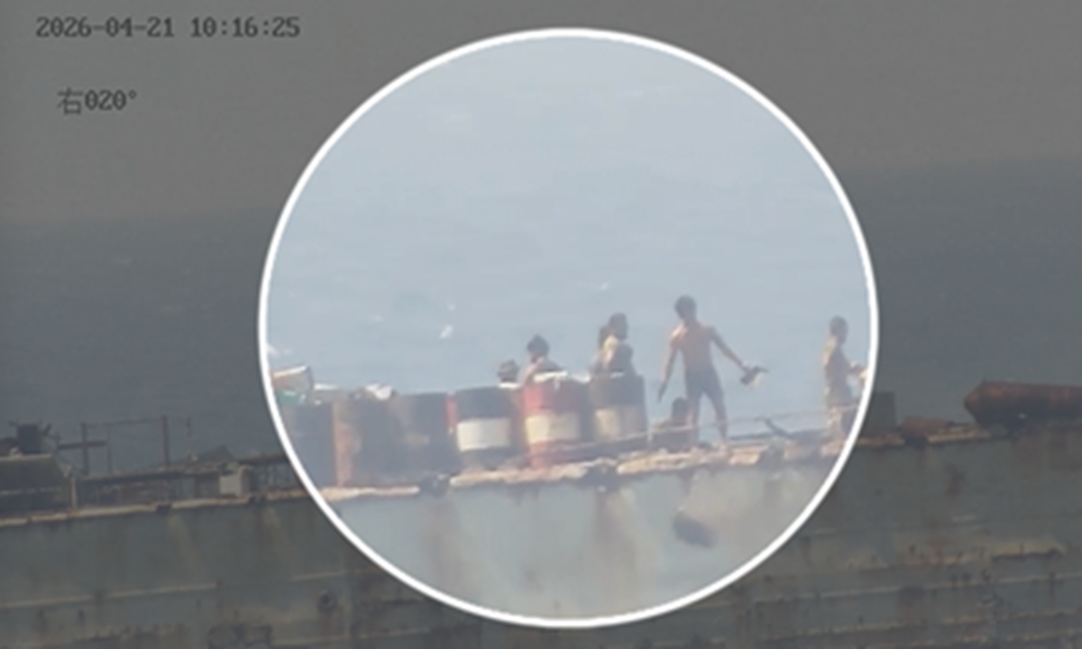 Video footage shows Philippine personnel on illegally grounded warship BRP Sierra Madre are burning garbage while disposing of waste into the water around Ren'ai Jiao. Photo: Screenshot from video provided by China Coast Guard